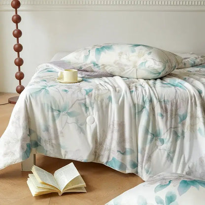 A soft white duvet cover with a teal and pale gray floral pattern in decorbites knitted cotton print summer quilt style