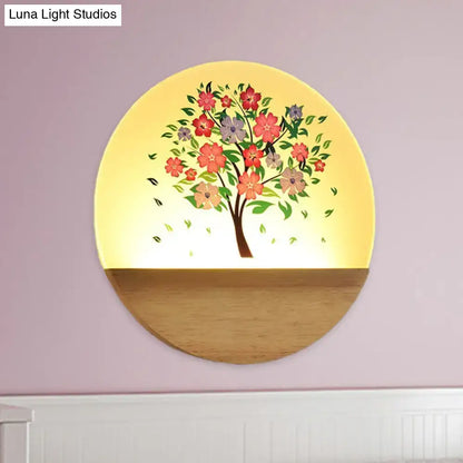 Floral tree acrylic shade wall light with a warm yellow glow and animal flowering design on wooden base for bedroom use