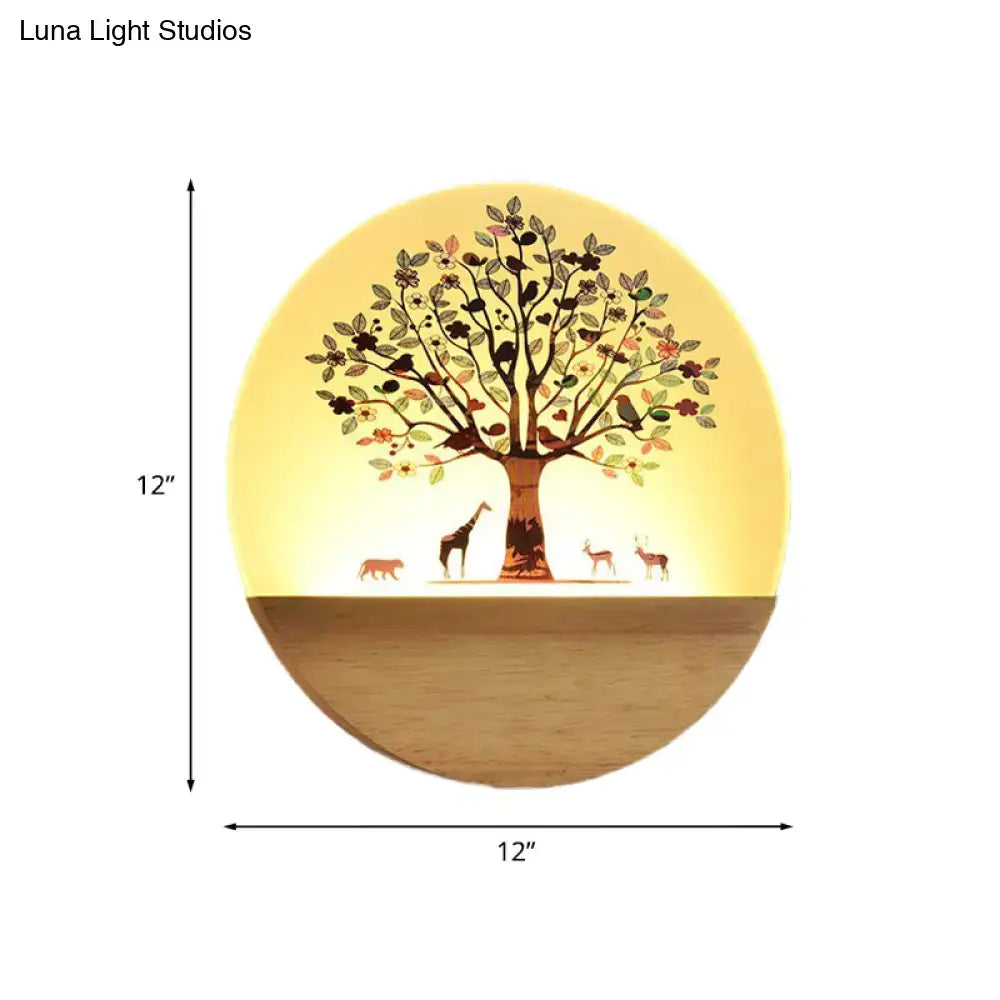 Circular wooden wall light with glowing animal flowering tree and acrylic shade for bedroom night light