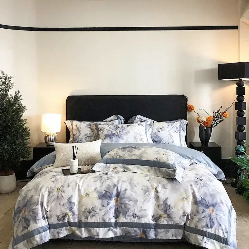 Elegant floral watercolor blue and white egyptian cotton bedding set with gray accents in a bedroom setting