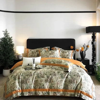 Elegant floral-patterned egyptian cotton bedding set in muted sage green and warm orange with satin-trimmed edge