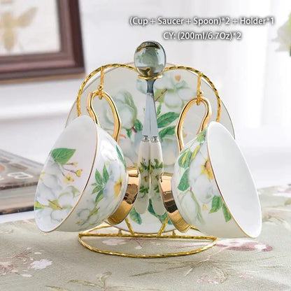 Elegant white porcelain teacups with green yellow floral patterns and gold accents on a decorbites camellia bone china stand
