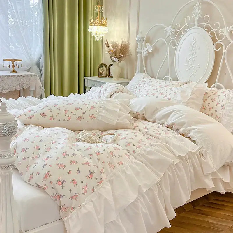 White cotton bedding set with delicate pink floral pattern and pleat lace ruffles in soft fabric for bedroom ensemble