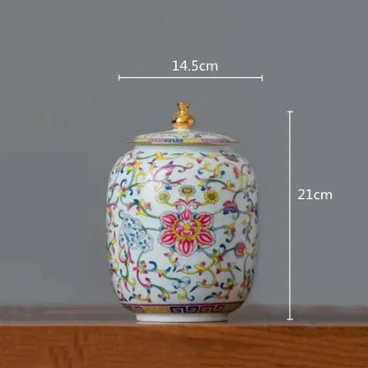 White enamelled porcelain tea caddy ginger jar with gold lid and colorful floral patterns for dining room use