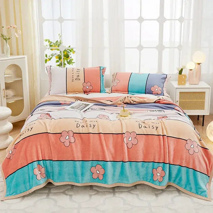 Floral white and navy cozy flannel plush blanket with pastel peach and teal stripes and pink daisy decorbites cozy flannel