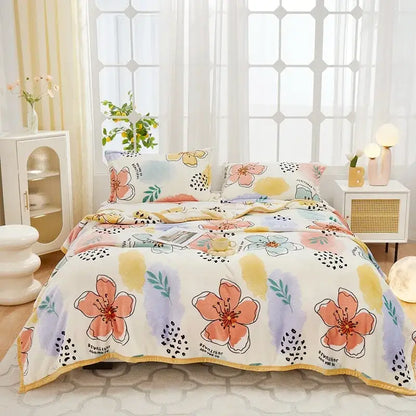 Pastel floral comforter set with peach and lavender blossoms on cream background paired with decorbites cozy flannel plush blanket