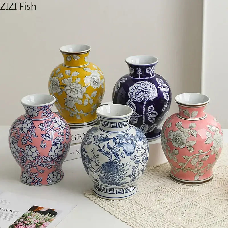 Set of five vibrant ceramic vases featuring floral and geometric patterns in white porcelain for living room decor