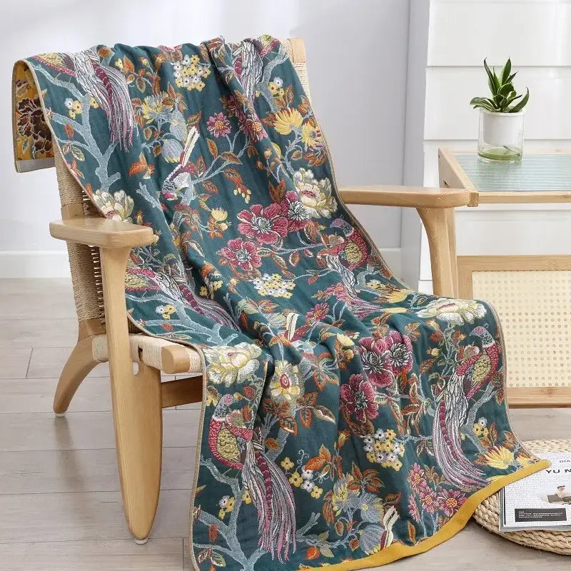 Teal floral cotton gauze bath towel with vibrant bird and flower patterns and yellow border from decorbites quick dry wrap
