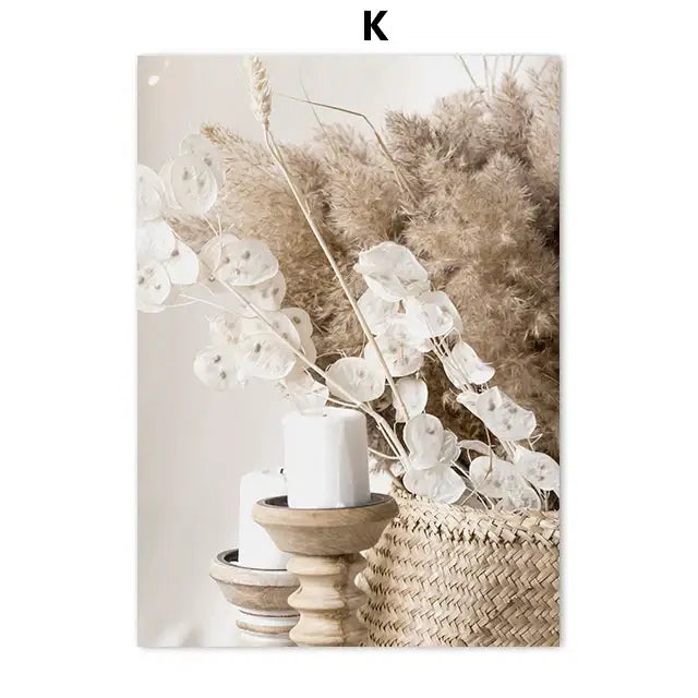 A rustic wooden candle holder with smooth natural finish holding a white pillar candle beside beige flower grass wall art print