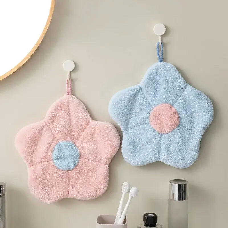 Flower shaped pink and light blue coral fleece hand towels with plush texture and contrasting circular centers for bathroom decorbites coral fleece hand towels