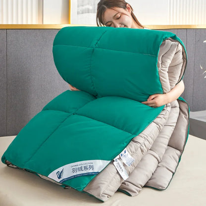 Teal and beige quilted down comforter with swan logo label featuring quilt code for lightweight warm winter use
