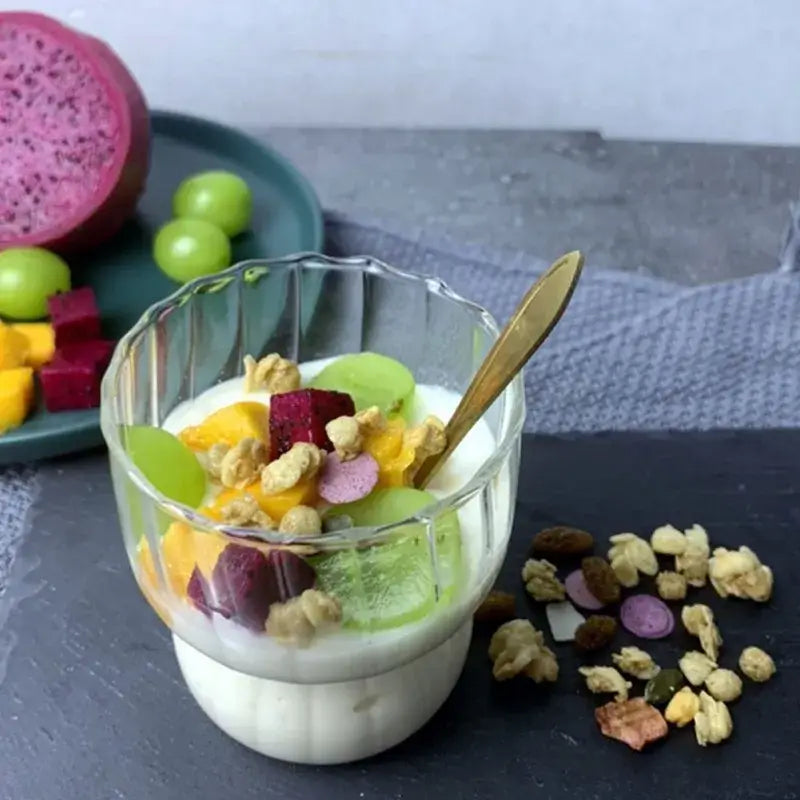 Fluted clear glass coffee mug ribbed tumbler filled with yogurt fresh fruit and granola by decorbites glass coffee