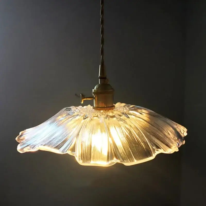 Fluted clear glass pendant light with brass finish featuring warm glowing decorbites clear glass shade for kitchen dining