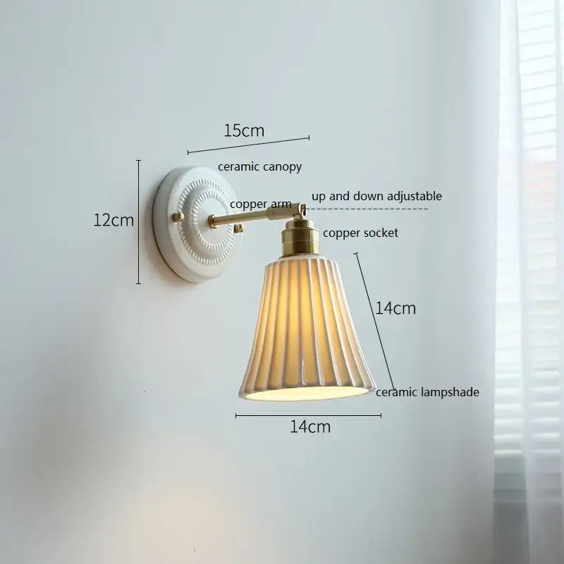 Fluted cream ceramic wall lamp with brass accents featuring a white ceramic canopy for bathroom decorbites ceramic wall lighting