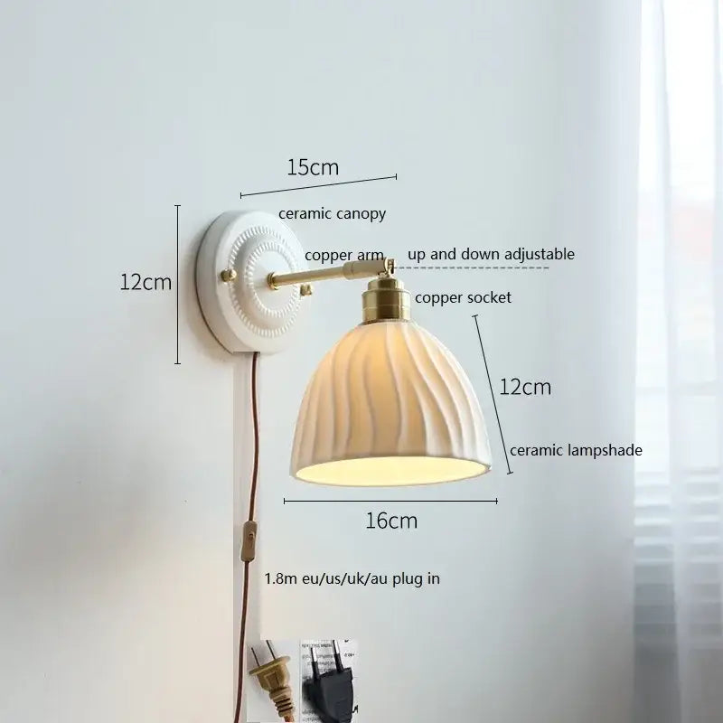 Fluted cream ceramic wall lamp with brass accents featuring a ribbed ceramic shade for bathroom lighting decorbites ceramic wall