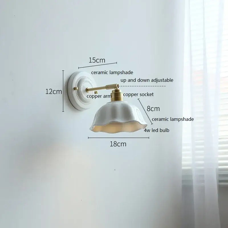 Fluted cream ceramic wall lamp with brass accents featuring a white ceramic lampshade and ruffled edge decorbites ceramic wall