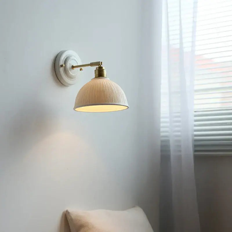 Fluted cream ceramic wall lamp with brass accents decorbites ceramic wall sconce ideal for bathroom light decor