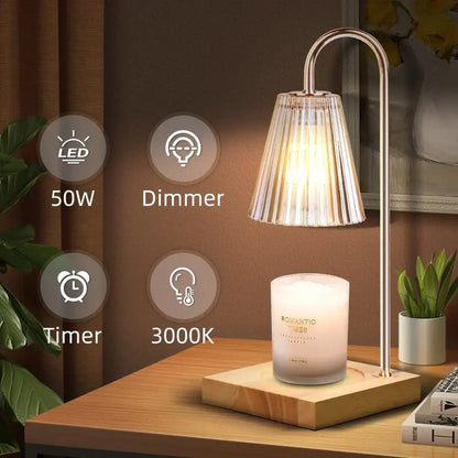 A sleek gold wax melting candle warmer with a curved metallic stand and pleated fluted glass shade for decorbites decor