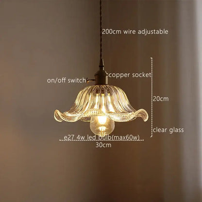 Delicate clear glass pendant light with fluted petal design and exposed bulb for decorbites green stripe kitchen fixture