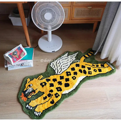 A hand tufted flying tiger leopard rug with olive green edges yellow body black spots and white wings for bedroom decor