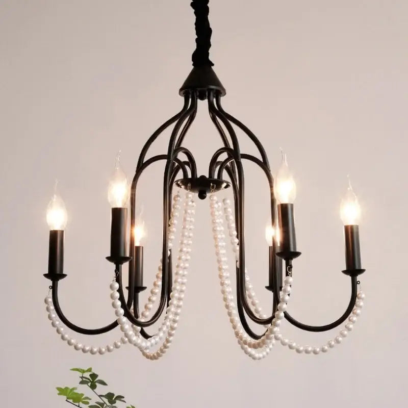 Black wrought iron e14 candle chandelier with cascading white pearls and five lit bulbs for elegant living room decorbites black e14