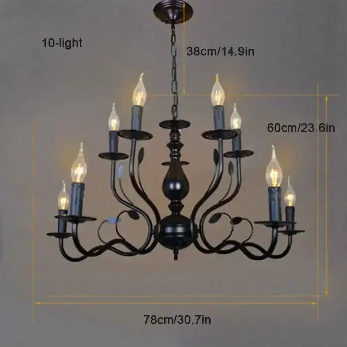 Black wrought iron french candle chandelier with ten candle-style lights and ornate leafy scrollwork in antique bronze