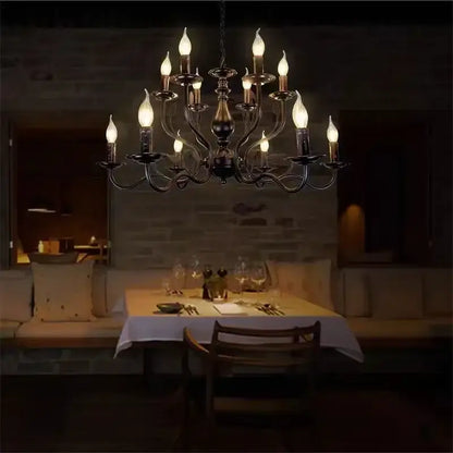Antique bronze french candle chandelier with ornate curved arms and multiple candle-style bulbs for dining room lighting