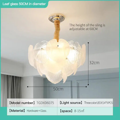 French cream crystal chandelier featuring delicate white leaf-shaped glass petals and a gold-toned adjustable fixture