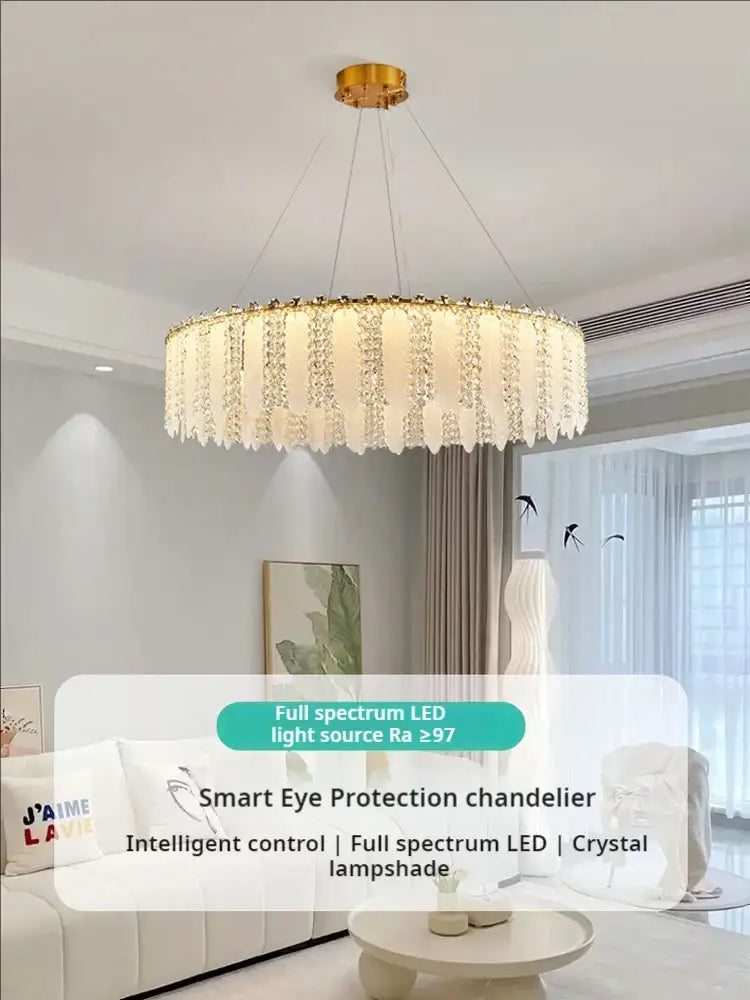 A modern decorbites french cream wind crystal chandelier with cascading droplets and gold-toned ceiling mount