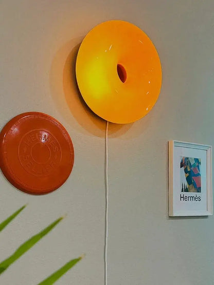Vibrant orange glossy decorbites french decorative wall lamp with illuminated central hole for bedroom bedside lighting