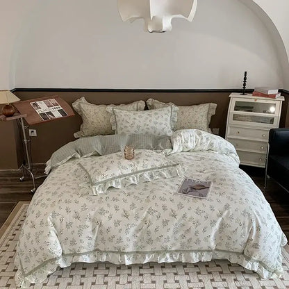 A soft off-white bedding set with green botanical prints and ruffled edges for decorbites french floral decor