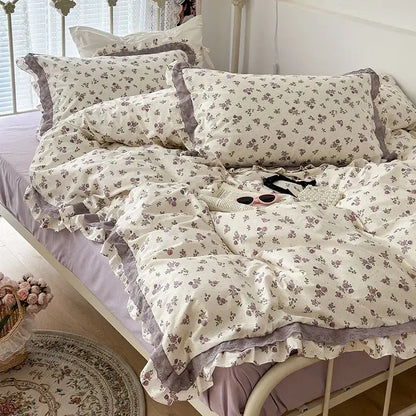 Cream-colored floral bedding set with delicate gray double layer lace ruffles for elegant bedroom decor