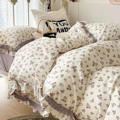 Cream-colored floral bedding set with delicate purple blossoms and double layer lace ruffles for bedroom use