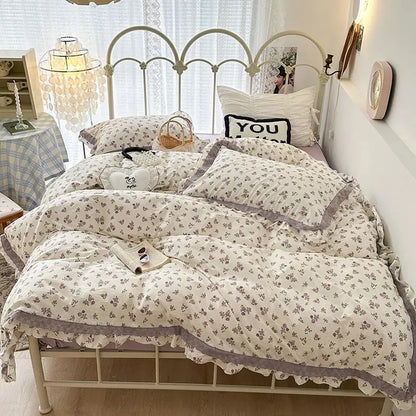 Cream-colored floral bedding set with double layer lace ruffles and gray trim for a cozy bedroom look