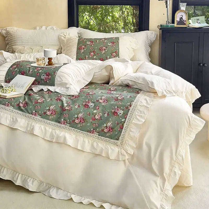 A delicate green floral bed runner with ruffled edges and lace trim featuring pink roses in decorbites french flowers bedding set