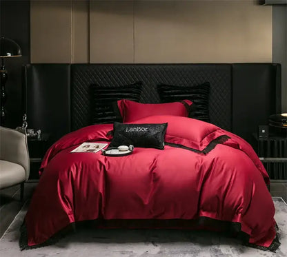 Red satin bedding set with black lace trim and matching pillows on quilted headboard decorbites french lace edge