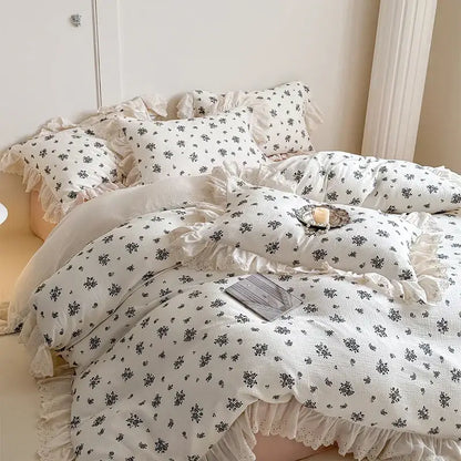White cotton bedding set with delicate ruffles and lace trim featuring decorbites french lace floral design