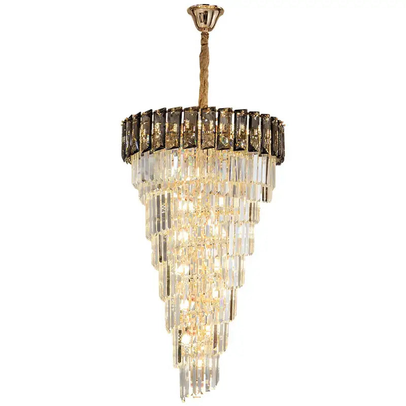 A tiered amber crystal chandelier with cascading clear and dark glass prisms for luxury living room decor