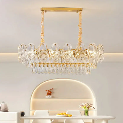 Gold-toned decorbites crystal rose chandelier with clear crystal roses and dangling teardrop crystals for dining room decor