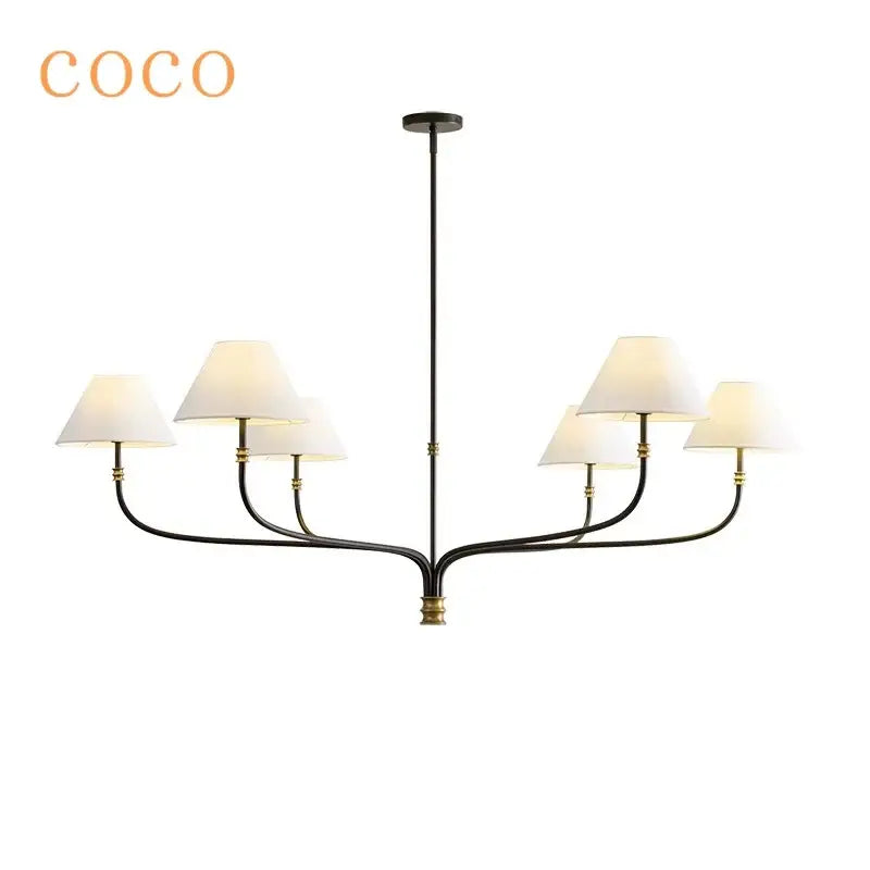 Coco black and brass pendant light with six off-white fabric shades for minimalist dining room decor