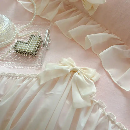 A delicate ivory satin bow with soft folds on decorbites french princess lace pink velvet bedding set for elegant bedroom decor