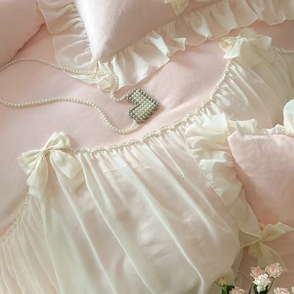 Cream-colored satin ruffled nightgown with delicate bow ties at the waist complementing decorbites french princess lace bedding set