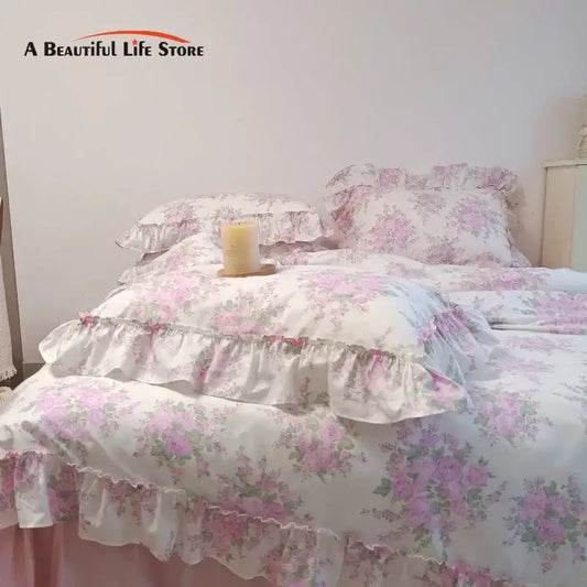 Pink floral ruffled cotton bedding set with french rose flowers print and soft layered design for bedroom use