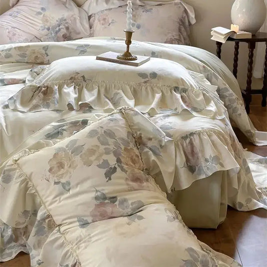 A cream-colored bedding set with french rose flowers and layered ruffles for decorbites french rose bedroom decor