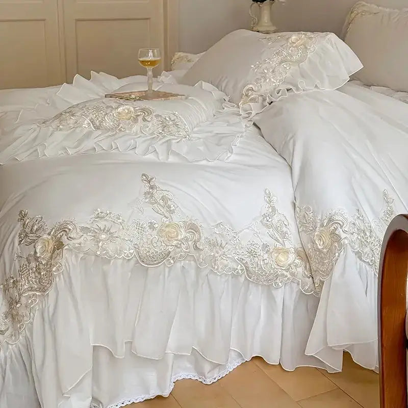 White satin lace bedding set with ruffles featuring intricate silver lace embroidery and floral appliqués decorbites french rose