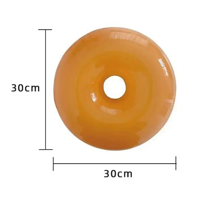 Glossy orange inflatable donut shaped pool float with 30cm diameter used as decorative wall lamp bedroom light