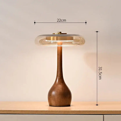 A French style walnut table lamp with a warm wooden base and translucent glass dome shade for bedroom use