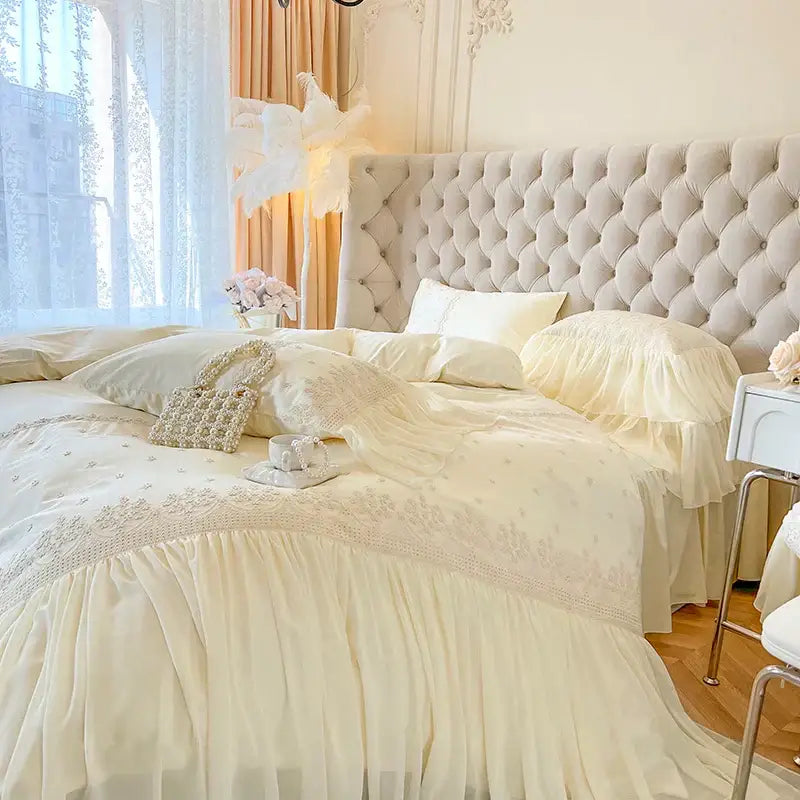 Cream-colored tufted headboard with soft upholstery and button detailing in decorbites french vintage lace ruffles bedding set decor