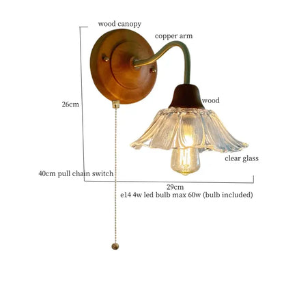 French vintage copper wall sconce with warm wood canopy, copper arm, and clear fluted glass shade by Decorbites