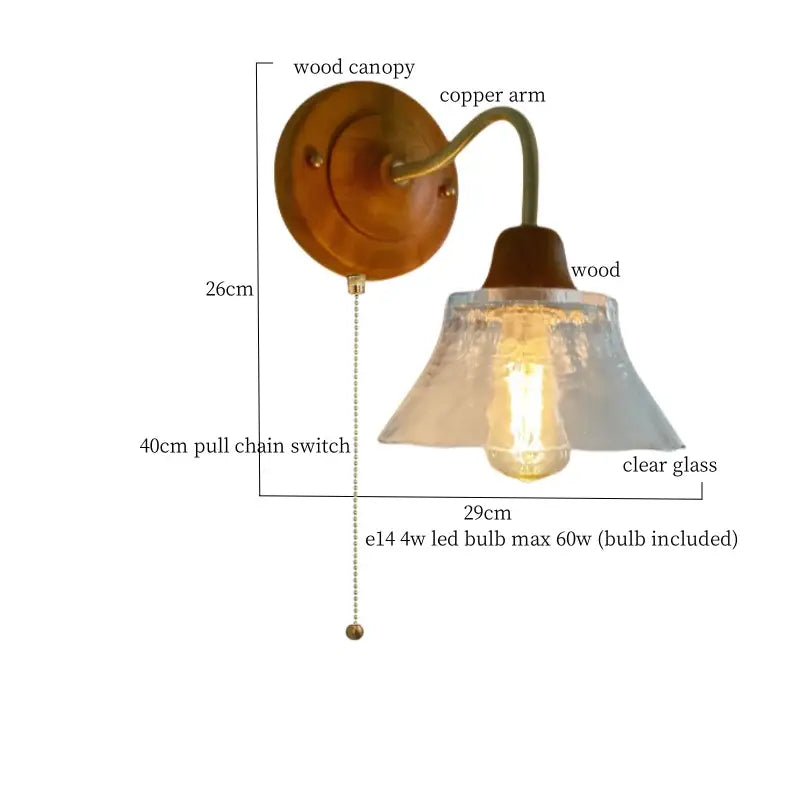 Warm-toned wooden wall sconce with curved french vintage copper arm and clear textured glass shade decorbites french vintage